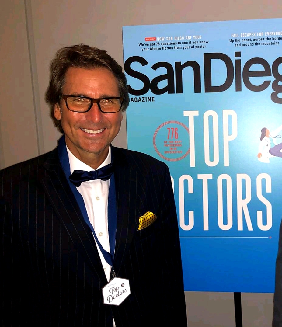 Dr. Mansfield in Front of San Diego Top Doctors Poster